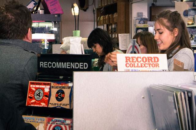Staff behind the till serving customers in David's Music on Record Store Day 2015